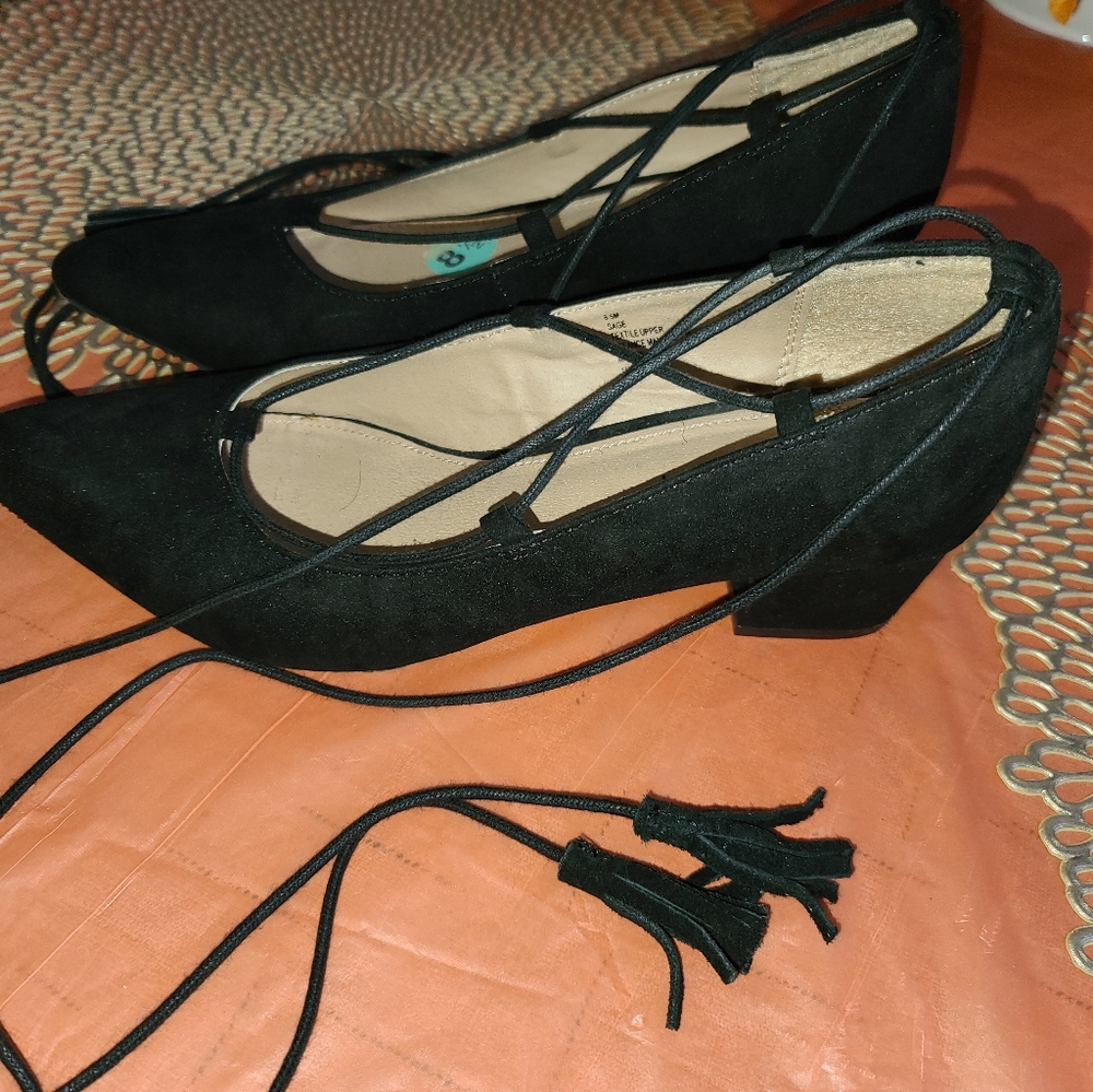 Black block heels with tassels